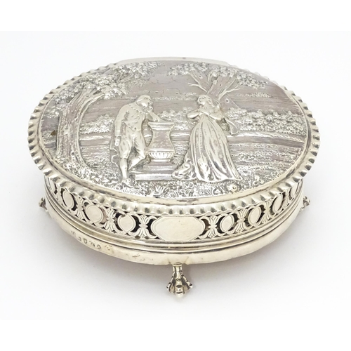 460 - WITHDRAWN FROM AUCTION
A Geo III silver lidded box decorated with embossed landscape scene to top wi... 