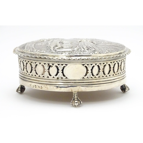 460 - WITHDRAWN FROM AUCTION
A Geo III silver lidded box decorated with embossed landscape scene to top wi... 