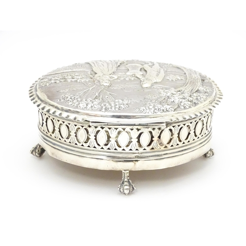 460 - WITHDRAWN FROM AUCTION
A Geo III silver lidded box decorated with embossed landscape scene to top wi... 