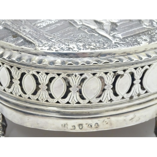 460 - WITHDRAWN FROM AUCTION
A Geo III silver lidded box decorated with embossed landscape scene to top wi... 