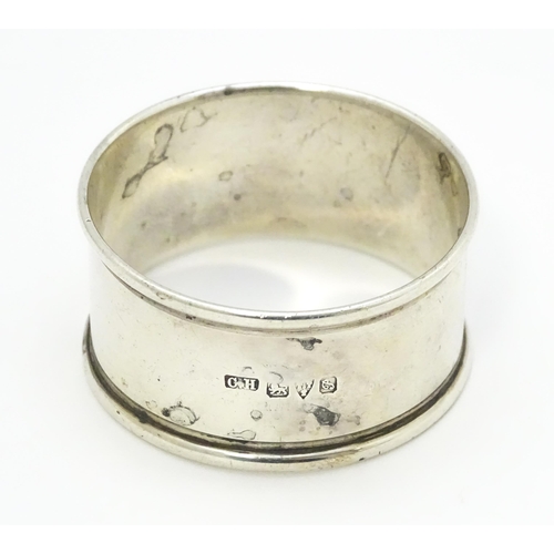 465 - A silver napkin ring hallmarked Chester 1915, maker Charles Horner