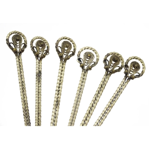 472 - A set of six white metal spoons with tongs en suite with coin formed bowls. Together with an anchovy... 