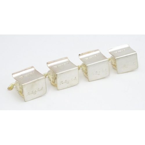 473 - A set of four Elizabeth II hallmarked silver menu / place card holders with horse detail, maker Came... 