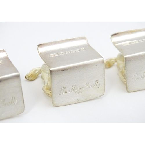 473 - A set of four Elizabeth II hallmarked silver menu / place card holders with horse detail, maker Came... 