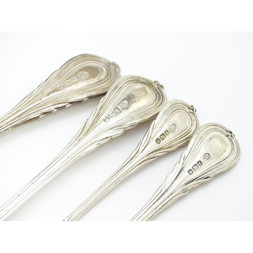 477 - A quantity of assorted Victorian silver Lily pattern items to include a sauce ladle, pickle fork, bu... 