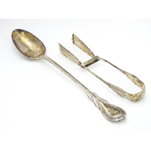 484 - A Victorian silver Lily pattern stuffing / basting spoon. Together with Victorian silver Lily patter... 