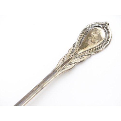 484 - A Victorian silver Lily pattern stuffing / basting spoon. Together with Victorian silver Lily patter... 