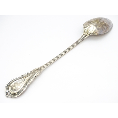 484 - A Victorian silver Lily pattern stuffing / basting spoon. Together with Victorian silver Lily patter... 