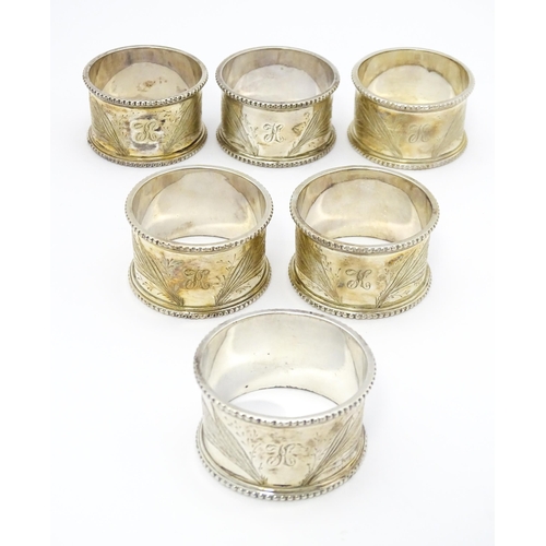 485 - Six Victorian silver napkin rings with engraved Lily of the Valley decoration, hallmarked Sheffield ... 