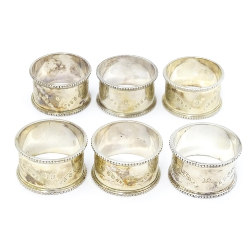 485 - Six Victorian silver napkin rings with engraved Lily of the Valley decoration, hallmarked Sheffield ... 