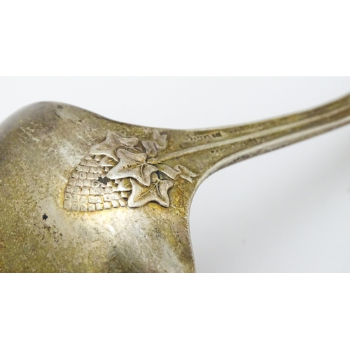 489 - An American sterling silver sauce ladle by Tiffany & Co. the handle decorated with rams head and dev... 