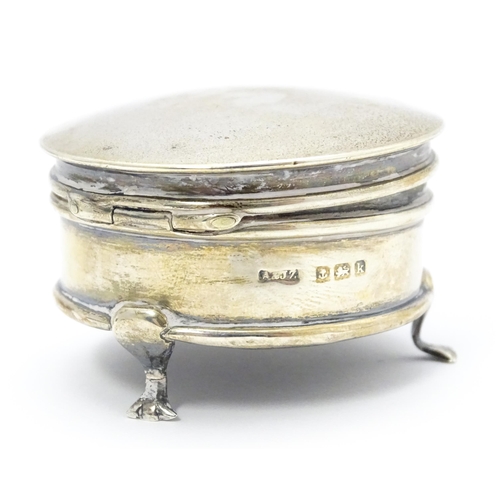 491 - A small silver ring box raised on three feet, hallmarked Birmingham 1909, maker A & J Zimmerman Ltd.... 