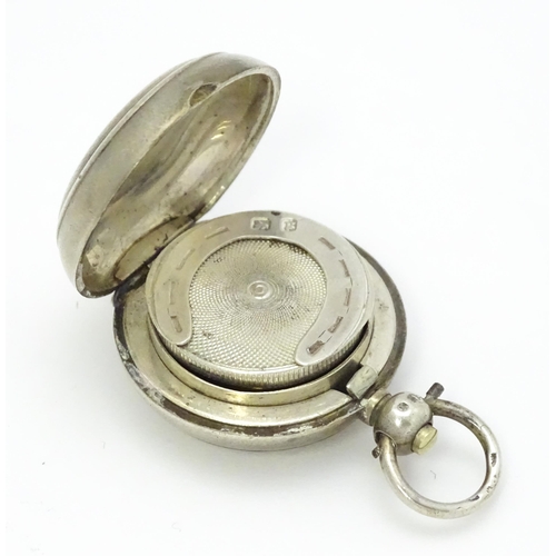 498 - A Victorian silver sovereign case / carrier with engine turned decoration and horseshoe detail withi... 