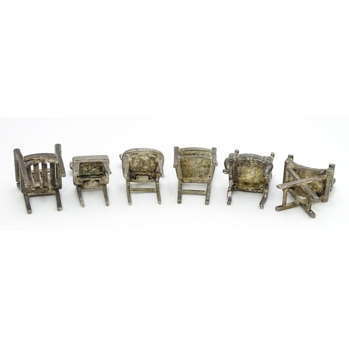 499 - Six assorted silver plate menu / table place card holders each modelled as various types of chairs. ... 