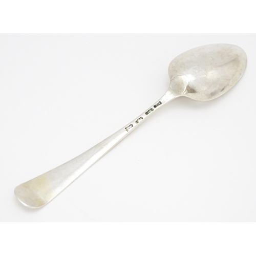 501 - An 18thC silver Old English pattern dessert spoon hallmarked London 1777, maker George Smith. Approx... 