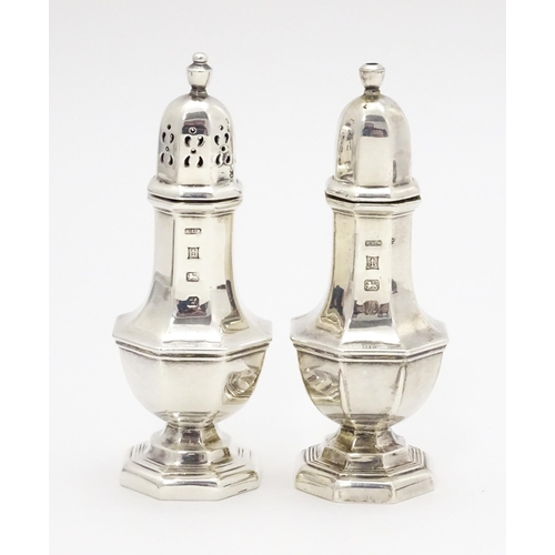 509 - Silver salt and pepper pots hallmarked Birmingham 1984/84 maker R E Porter. Approx 4