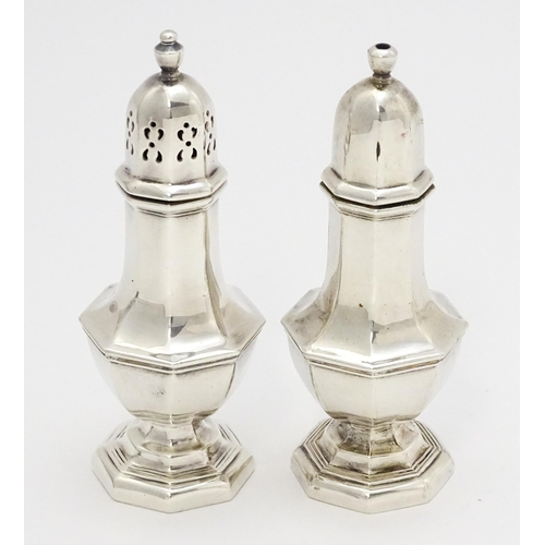 509 - Silver salt and pepper pots hallmarked Birmingham 1984/84 maker R E Porter. Approx 4