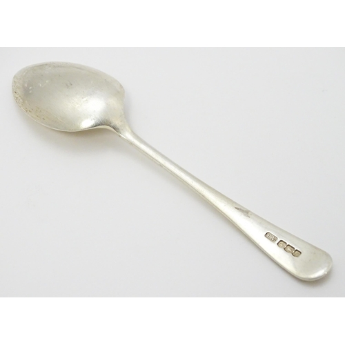 511 - A quantity of assorted silver spoons to include two with engraved decoration depicting a man playing... 