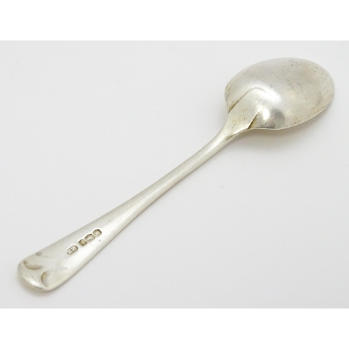 511 - A quantity of assorted silver spoons to include two with engraved decoration depicting a man playing... 