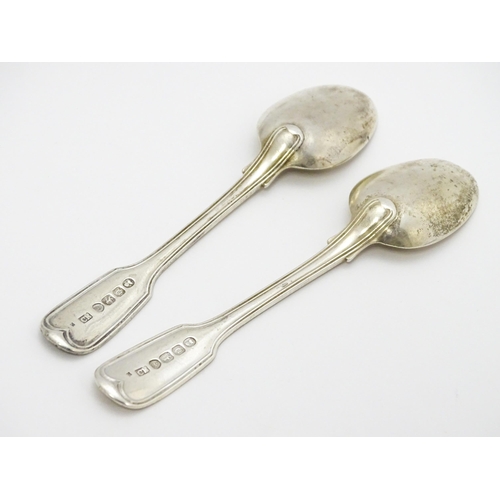 511 - A quantity of assorted silver spoons to include two with engraved decoration depicting a man playing... 