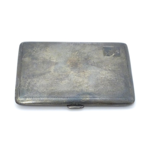 546 - A silver cigarette case with engine turned decoration hallmarked Birmingham 1953, maker Frederick Fi... 