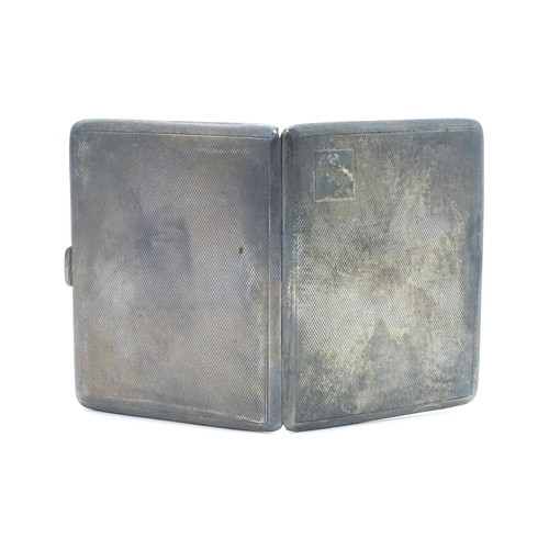 546 - A silver cigarette case with engine turned decoration hallmarked Birmingham 1953, maker Frederick Fi... 