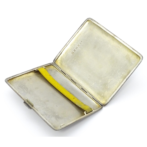 546 - A silver cigarette case with engine turned decoration hallmarked Birmingham 1953, maker Frederick Fi... 