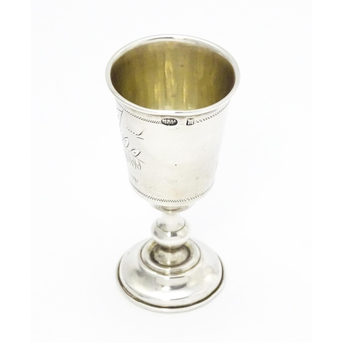 553 - A Russian silver kiddish cup with engraved decoration. Approx. 3 1/2