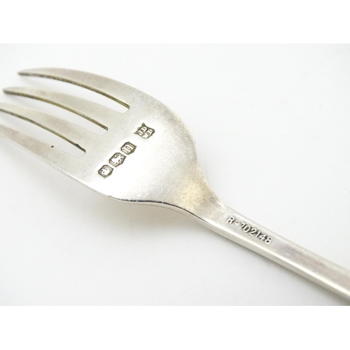 574 - Assorted silver items to include a spoon and fork hallmarked Sheffield 1930, maker James Deakin & So... 