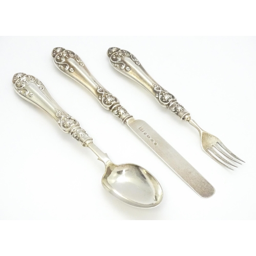 580 - A Victorian silver Christening set comprising knife, fork and spoon hallmarked Birmingham 1860, make... 