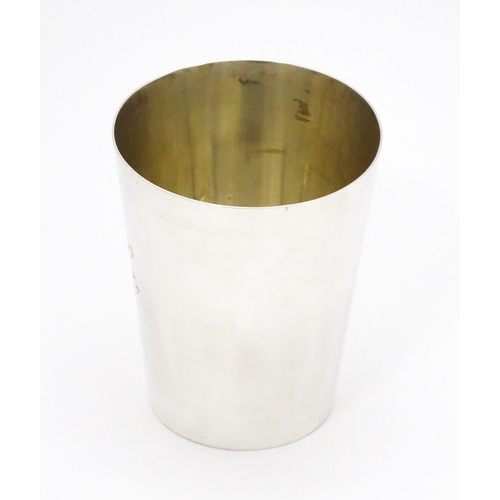606 - A Victorian silver beaker hallmarked London 1886, maker Charles Stuart Harris. Approx. 3 1/2
