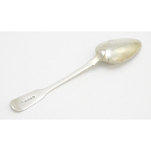 613 - A silver Fiddle pattern table spoon hallmarked London 1818, maker Richard Poulden. Approx. 8 1/2