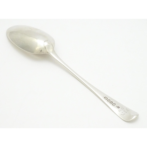 614 - A Geo III silver table spoon hallmarked London 1790, maker Richard Crossley. Approx. 8 1/2