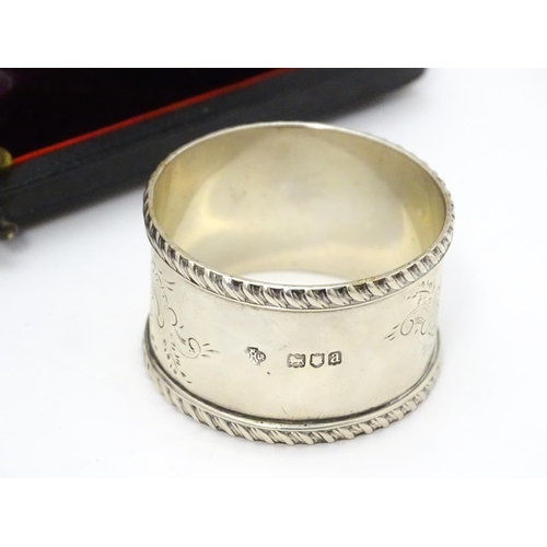 624 - A cased set of six Victorian silver napkin rings with engraved decoration and numbered 1-6, hallmark... 