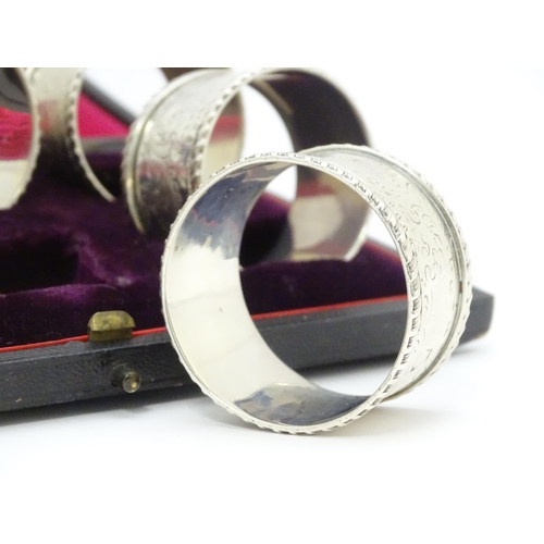 624 - A cased set of six Victorian silver napkin rings with engraved decoration and numbered 1-6, hallmark... 