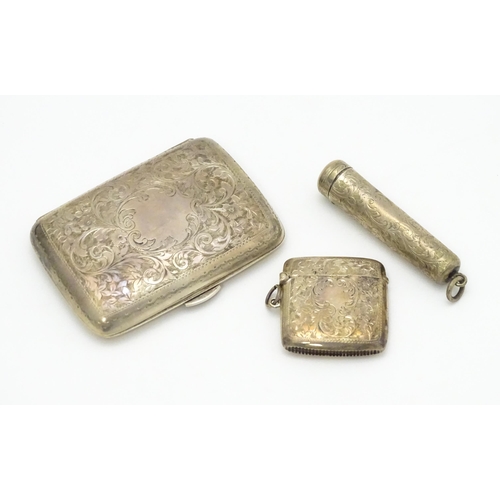 629 - A silver cigarette case and vesta case with engraved acanthus decoration, hallmarked Birmingham 1906... 