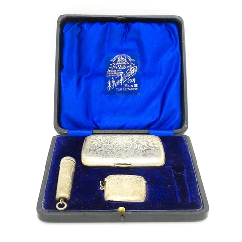 629 - A silver cigarette case and vesta case with engraved acanthus decoration, hallmarked Birmingham 1906... 