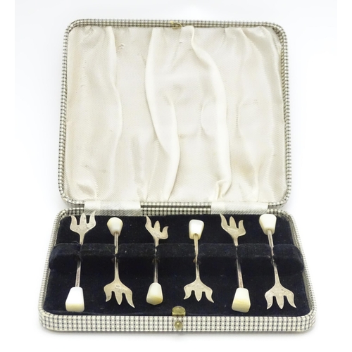 647 - A cased set of six silver sweetmeat forks with mother of pearl finials, hallmarked Sheffield 1938, m... 