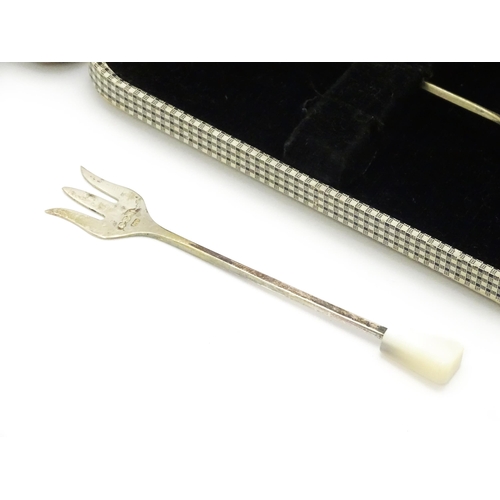 647 - A cased set of six silver sweetmeat forks with mother of pearl finials, hallmarked Sheffield 1938, m... 