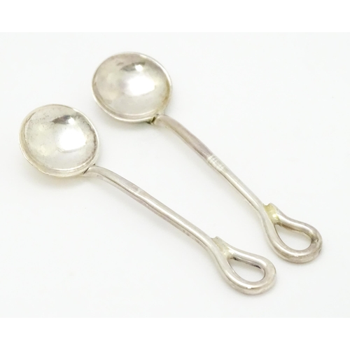 649 - A cased pair of silver salts and spoons hallmarked Birmingham 1942, maker Arnold E. Williams. Case a... 