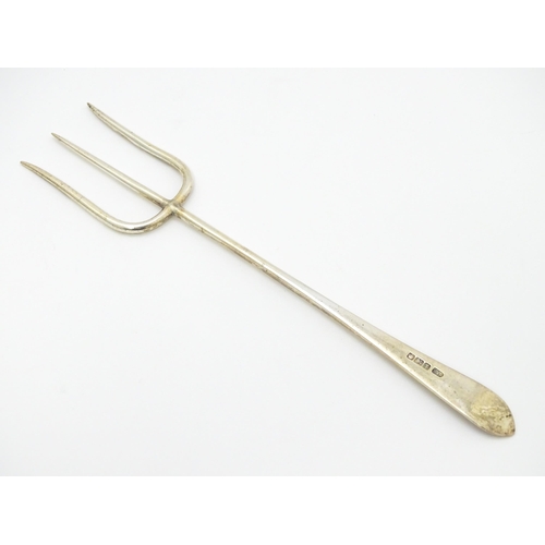 650 - A silver bread fork with bright cut decoration, hallmarked Sheffield 1915, maker C W Fletcher & Son ... 