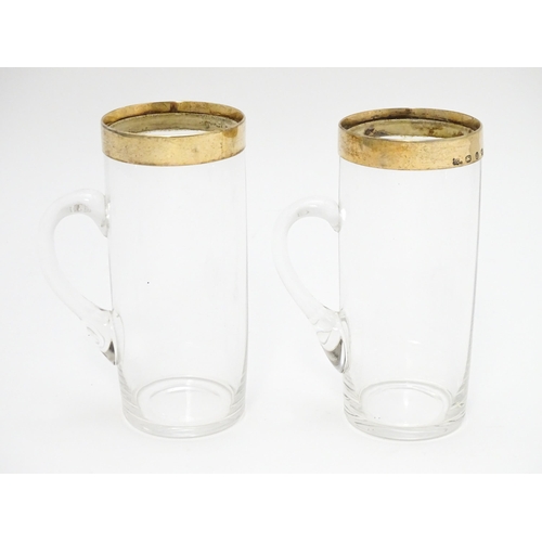 652 - A cased pair of Victorian glasses of mug form  with silver gilt mounts hallmarked Birmingham 1892, m... 