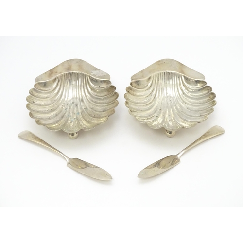 653 - A cased pair of silver butter dishes of scallop shell form, hallmarked Birmingham 1903 maker Minshul... 