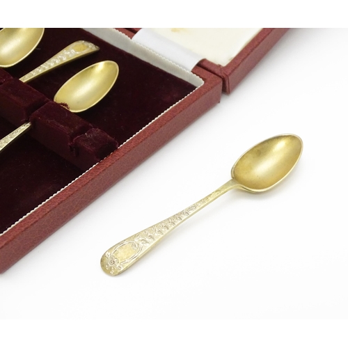 654 - A cased set of six silver gilt teaspoons with bright cut decoration hallmarked Sheffield 1902, maker... 