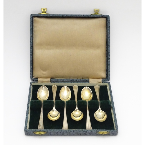 657 - A cased set of six silver teaspoons hallmarked Sheffield 1946 maker C W Fletcher & Son Ltd. Spoons a... 