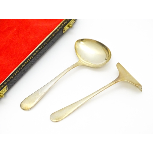 659 - A silver gilt Christening set comprising spoon and pusher hallmarked Sheffield 1959 / 61, maker Vine... 