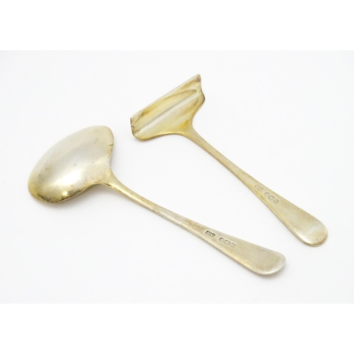 659 - A silver gilt Christening set comprising spoon and pusher hallmarked Sheffield 1959 / 61, maker Vine... 