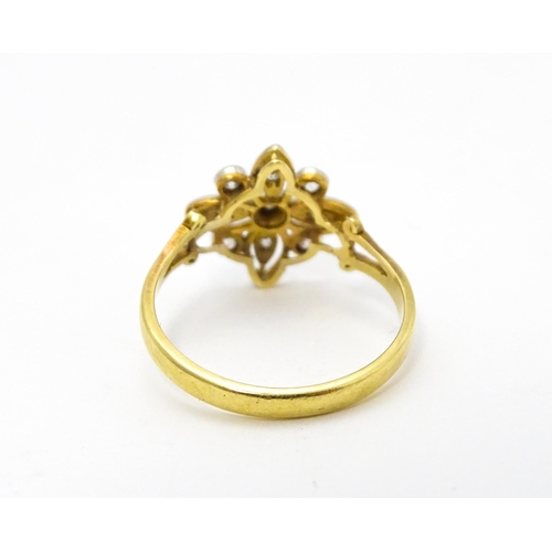 700 - An 18ct gold ring set with diamonds in a floral setting. Ring size approx. M