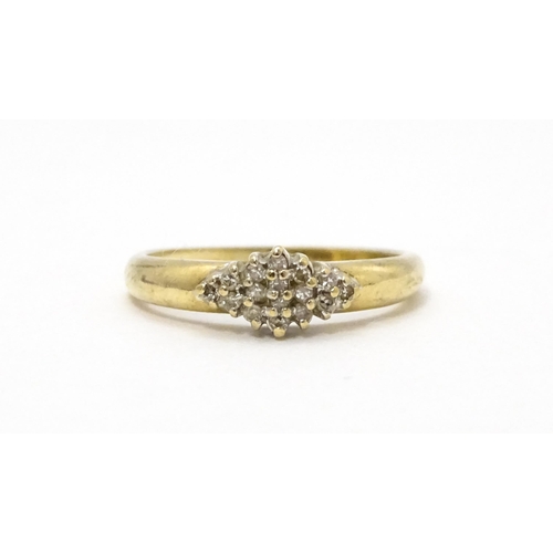 708 - A 9ct gold ring set with diamond cluster. Ring size approx. K 1/2