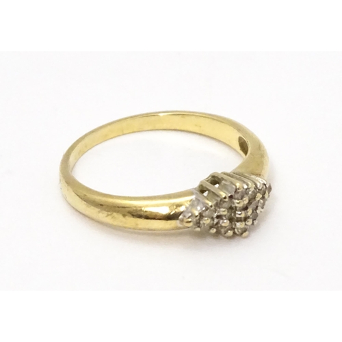 708 - A 9ct gold ring set with diamond cluster. Ring size approx. K 1/2